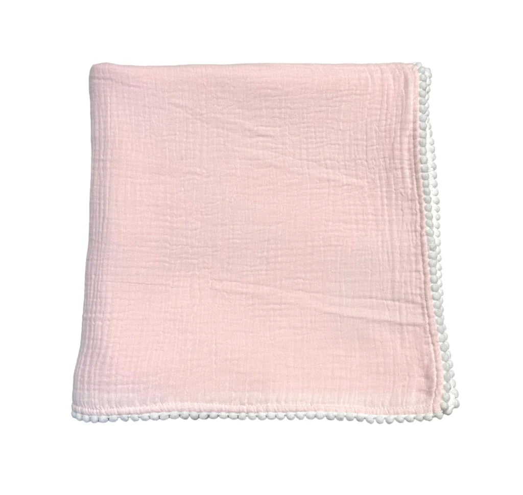 Cotton Muslin Swaddle Blanket- Pink folded neatly, featuring soft breathable fabric with delicate textured weave and a decorative white pom-pom trim edge.